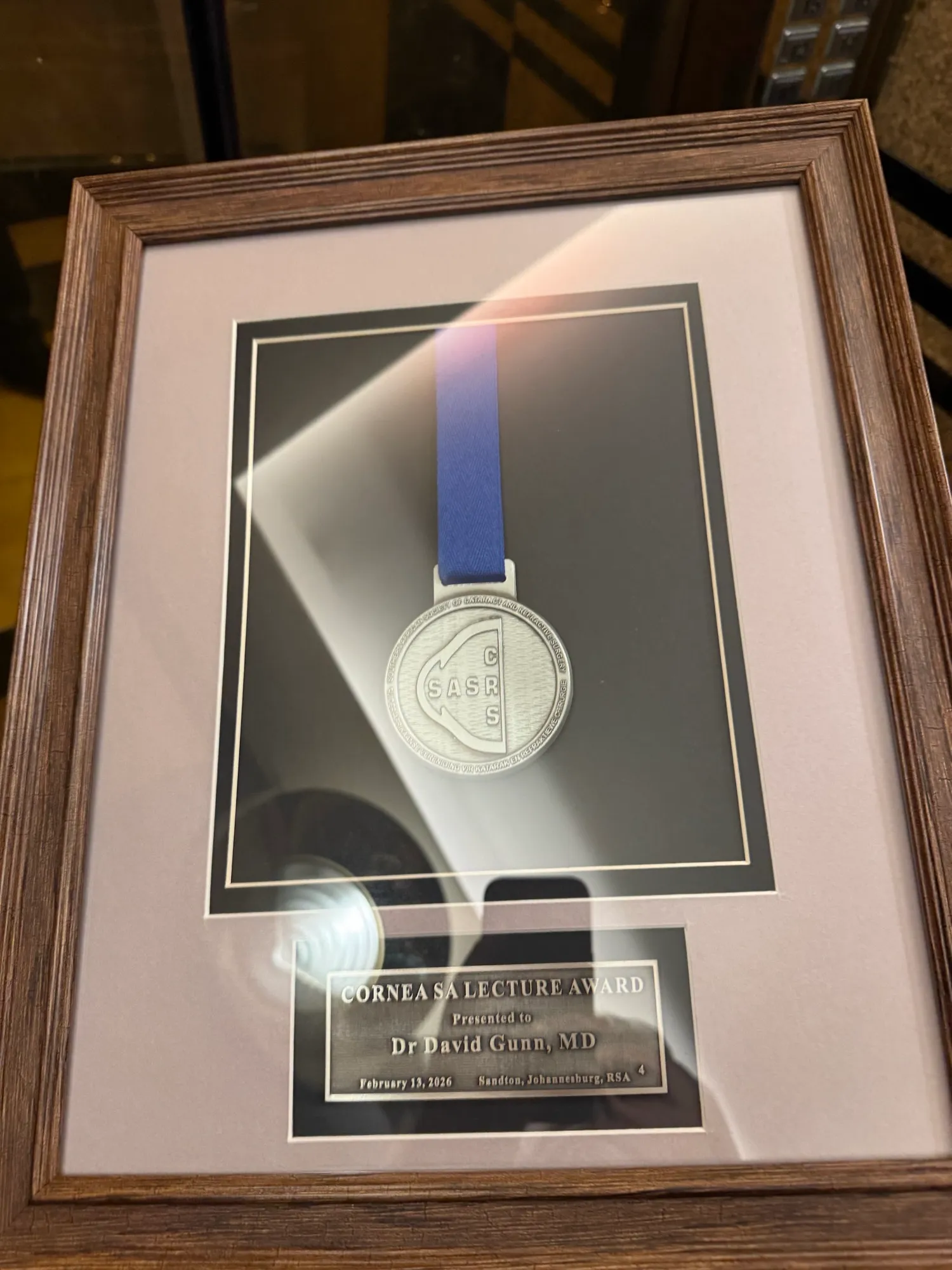 The framed Cornea SA Lecture Award medal presented to Dr David Gunn, MD, on 13 February 2026 in Sandton, Johannesburg.